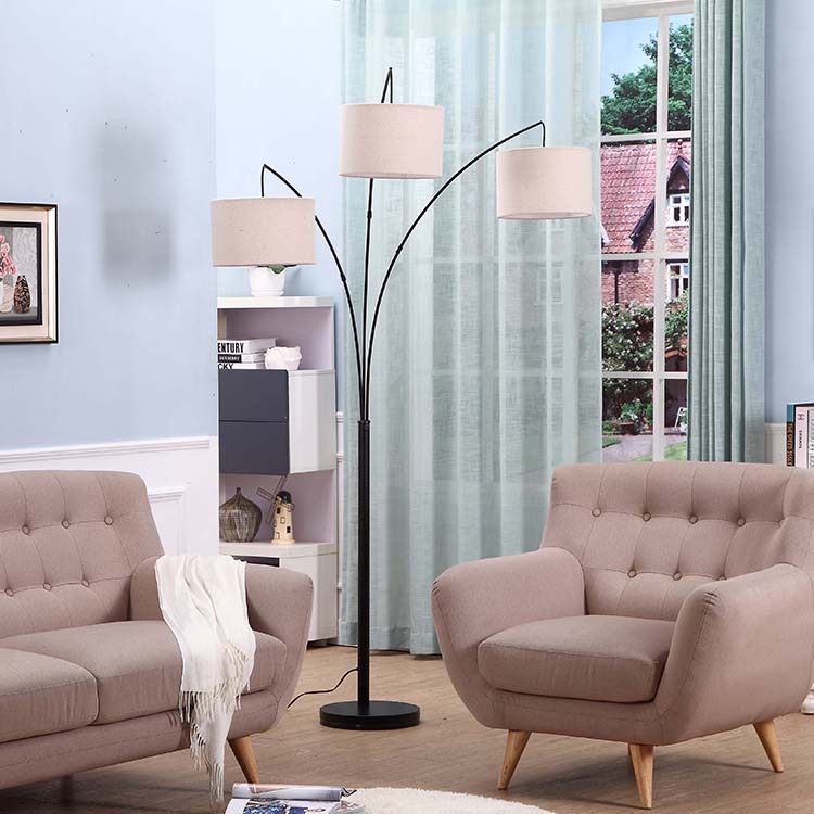 https://www.goodly-light.com/black-tall-multiple-head-arc-lamp-with-3-fabric-shade-hanging-lighting-for-reading-offices-modern-3-arm-floor-light-for-standing-behind-the-living-room-sofa-gl-flm03.html