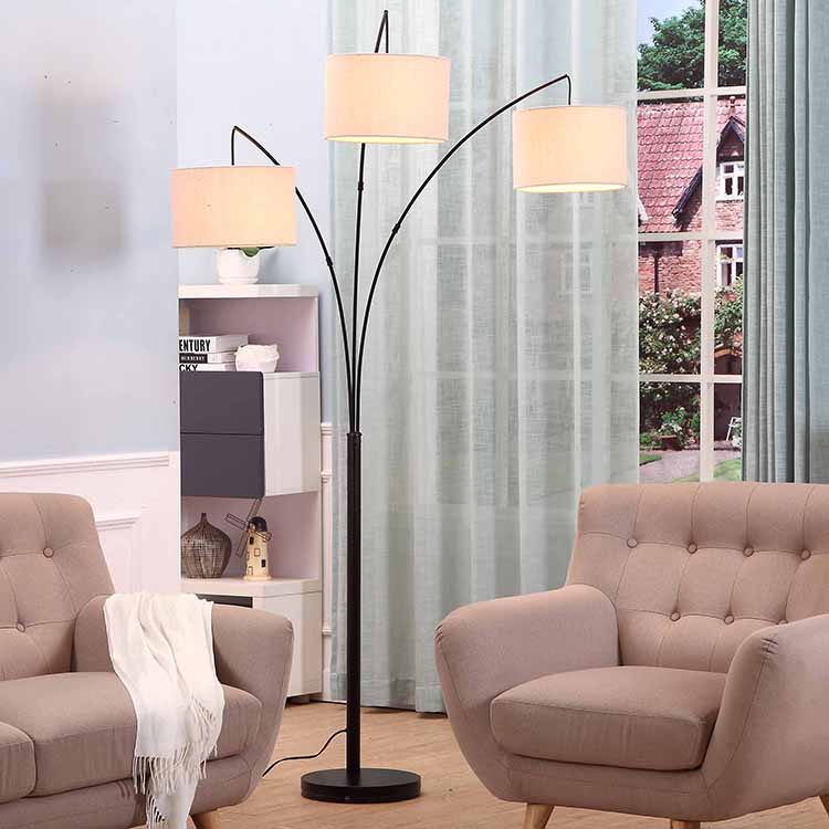 https://www.goodly-light.com/black-tall-multiple-head-arc-lamp-with-3-fabric-shade-hanging-lighting-for-reading-offices-modern-3-arm-floor-light-for-standing-behind-the-living-room-sofa-gl-flm03.html