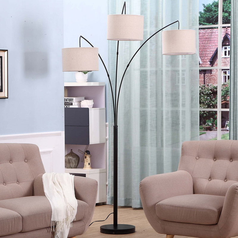 https://www.goodly-light.com/black-tall-multiple-head-arc-lamp-with-3-fabric-shade-hanging-lighting-for-reading-offices-modern-3-arm-floor-light-for-standing-behind-the-living-room-sofa-gl-flm03.html